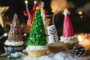 four cupcakes on table